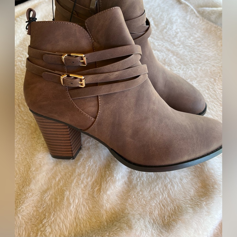 NWT beautiful ankle boots, never used. Cute buckle design.